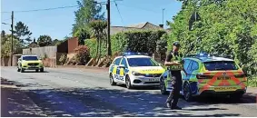  ?? Lewis Clarke ?? 6Police at the scene of the after the car crash on Post Hill, Tiverton