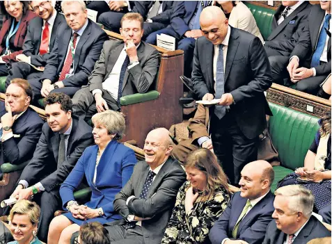  ??  ?? Sajid Javid appears to tickle the back benches, including Theresa May, as he makes his statement in the Commons, watched by Boris Johnson and Rishi Sunak, his new Chancellor