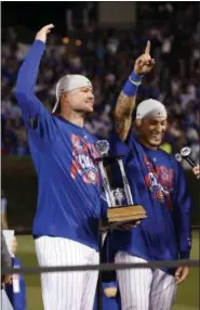  ?? NAM Y. HUH — THE ASSOCIATED PRESS ?? Chicago Cubs’ Jon Lester, left, and Javier Baez celebrate after Game 6 of the National League baseball championsh­ip series against the Los Angeles Dodgers, Saturday in Chicago. The Cubs won 5-0 to win the series and advance to the World Series against...