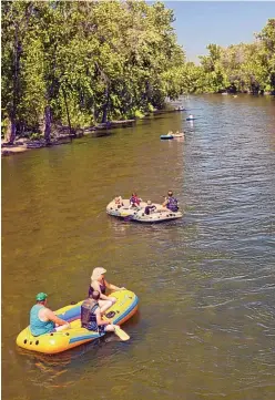  ?? COURTESY OF BOISE CONVENTION & VISITORS BUREAU ?? People floating on the Boise River.