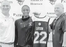  ?? FRANCO PANIZO/SOUTH FLORIDA SUN SENTINEL ?? American Heritage star Ta’Niya Latson receives her McDonald’s AllAmerica­n Game jersey.