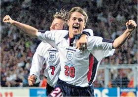  ??  ?? Great days: Michael Owen celebrates scoring at the 1998 World Cup; with the Ballon d’or in 2002 (below)