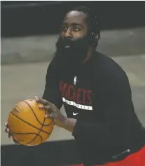  ?? CARMEN MANDATO/ GETTY IMAGES ?? Disgruntle­d Rockets star James Harden denies partying at a strip club, but the NBA still fined him for not wearing a mask at a social event, a violation of the league's COVID-19 safety rules.