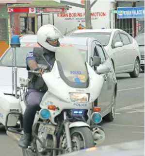  ??  ?? A Police officer on his motorcycle.