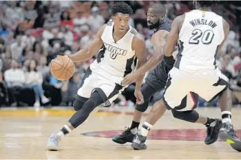  ?? MICHAEL LAUGHLIN/STAFF FILE PHOTO ?? “I think I was starting to show good growth before I was injured the last time,” says Heat guard Josh Richardson, left.