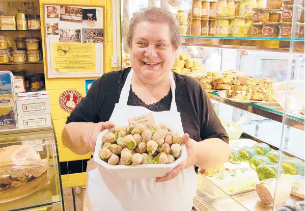  ??  ?? Escargot is a hit with the French. Much of the escargot in France is farmed these days, as chemicals have successful­ly killed off the slug and snail population­s, along with weeds and undesirabl­e insects.