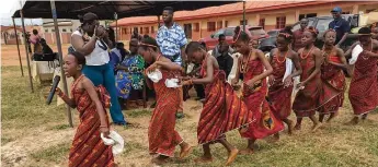  ?? ?? Benin Cultural Dance Troupe entertaini­ng the audience at the official handing over of education materials and library to Oba Erediauwa Primary School Iduonmwina, Benin City