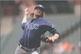  ?? The Associated Press ?? PERFECT START: Tampa Bay Rays starting pitcher Ryne Stanek throws to a Baltimore Orioles batter during the first inning of Sunday’s game in Baltimore.