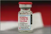  ?? DAVID ZALUBOWSKI — THE ASSOCIATED PRESS FILE ?? A vial of the Moderna COVID-19vaccine at a hospital in Denver.