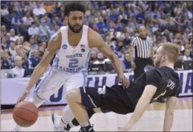  ?? BRANDON DILL — THE ASSOCIATED PRESS ?? North Carolina guard Joel Berry II (2) moves past Butler guard Tyler Lewis in the first half of an NCAA college basketball tournament South Regional semifinal game Friday in Memphis, Tenn.