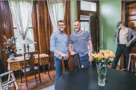  ?? Andrew Rush/Post-Gazette ?? Rick Astle and Tim Denham in the dining room with the mannequin.