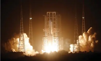  ?? Photograph: Tingshu Wang/Reuters ?? China’s Long March-5 rocket lifts off carrying the Chang’e-5 lunar probe.