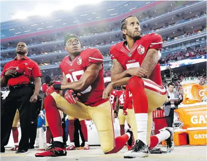  ?? — THE ASSOCIATED PRESS FILES ?? San Francisco 49ers safety Eric Reid, left, seen kneeling with former teammate Colin Kaepernick during the U.S. national anthem last season, says the 49ers have the blessing of the team’s CEO to protest by kneeling during the anthem if so inclined.