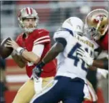  ?? JOSIE LEPE — THE ASSOCIATED PRESS FILE ?? 49ers quarterbac­k C.J. Beathard, left, passes against the Chargers during a preseason game in Santa Clara, Calif.