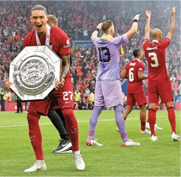  ?? ?? Darwin Nunez celebrates with the Community Shield after Liverpool beat Manchester City at the King Power Stadium on Saturday (AFP)