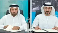  ?? — Supplied photo ?? Sultan Butti bin Mejren and Hamed Ali sign the agreement to collaborat­e for property-related listings.