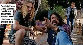  ?? ?? Foo frighters: Dave (centre right) and bandmate Taylor Hawkins in Studio 666