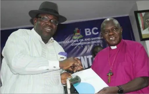  ??  ?? Governor Dickson receiving an interim report from Dr. John Sentamu