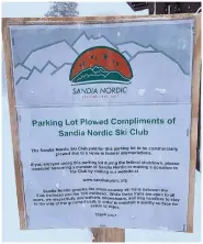  ?? JOURNAL PHOTO ?? A sign at the Ellis Trailhead off N.M. 536 solicits donations to help Sandia Nordic keep parking lots cleared.