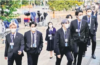  ?? — AFP photos ?? Members of the South Korean band BTS arrive to security check-in at the United Nations headquarte­rs during the 76th Session of the UN General Assembly in New York.