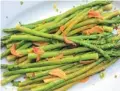  ?? MELISSA D’ARABIAN VIA AP ?? Quick-sauteed asparagus with a soysauce glaze is a dish from a recipe by Melissa d’Arabian.