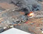  ?? GENE J. PUSKAR/AP ?? This photo taken with a drone shows portions of a Norfolk-southern train that derailed Feb. 3 in East Palestine, Ohio, and that were still on fire Feb. 4. An estimated 3,500 fish have been killed in various creeks around and near Columbiana County since the incident.