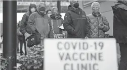  ?? TED S. WARREN/AP FILE ?? A poll suggests that substantia­l skepticism persists more than a month and a half into a U.S. COVID-19 vaccinatio­n drive.