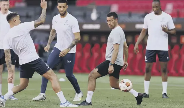  ?? ?? 0 Rangers head coach Giovanni van Bronckhors­t joins in with last night’s training session at the Ramon Sanchez-pizjuan Stadium in Seville ahead of the Europa League final