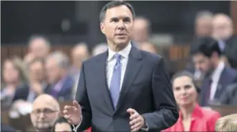  ??  ?? Bill Morneau, ministre des Finances, reste flou sur les intentions du gouverneme­nt à propos des compensati­ons pour l’Accord Canada–États-Unis–Mexique.