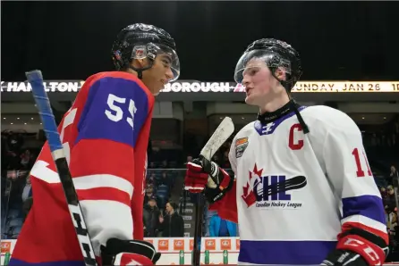  ?? The Canadian Press ?? Quinton Byfield, left, and Alexis Lafreniere talk following the CHL Top Prospects Game in Hamilton, Ont., on Jan. 16.