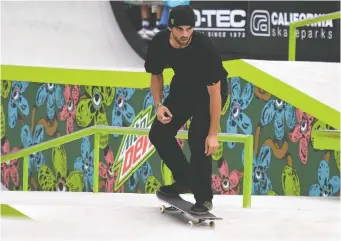  ?? ORaNGE COUNTY REGISTER FILES VIA THE ASSOCIATED PRESS ?? Canadian Matt Berger competes in the men’s street skateboard final during the Dew Tour at the Long Beach Convention Center in June in Long Beach, Calif.