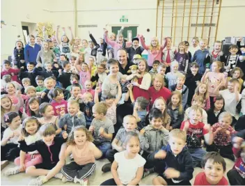  ??  ?? Ella Stanier (centre) with pupils at Coates Primary School enjoying a non-uniform day