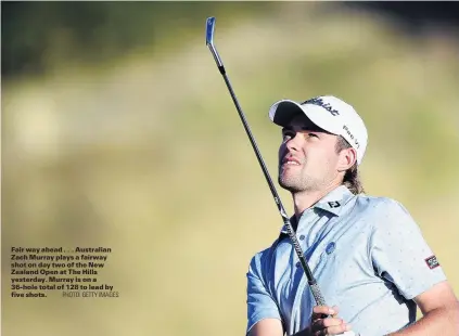  ?? PHOTO: GETTY IMAGES ?? Fair way ahead . . . Australian Zach Murray plays a fairway shot on day two of the New Zealand Open at The Hills yesterday. Murray is on a 36hole total of 128 to lead by five shots.