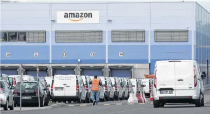  ?? RALPH ORLOWSKI/REUTERS ?? An outside view of an Amazon logistics centre in Mannheim, Germany, Sept. 17.