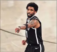  ?? Adam Hunger / Associated Press ?? Nets guard Kyrie Irving reacts against the Bucks during Game 1 of their second-round playoff series on June 5.