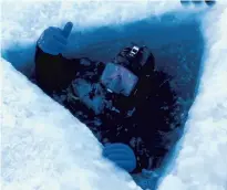  ?? MASTER CHIEFJOSH DUMKE/U.S. NAVY ?? Petty Officer 2nd Class Ken Lancaster, a Little Creek-based Seabee with Underwater Constructi­on Team 1, surfaces during an exercise in northern Greenland.