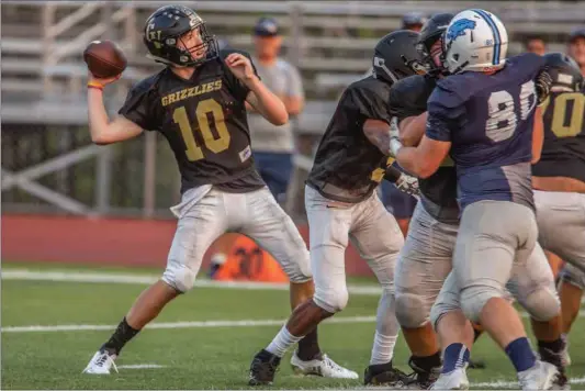  ?? Cory Rubin/The Signal (See additional photos on signalscv.com) ?? Golden Valley quarterbac­k Zack Chevalier lets loose a long pass in a scrimmage against Crescenta Valley at Harry Welch Stadium Friday night.