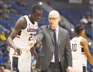  ?? Jessica Hill / Associated Press ?? Coach Dan Hurley, right, Akok Akok and the UConn men’s basketball team will host New Hampshire on Sunday.
