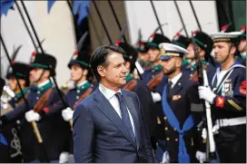  ?? ELISABETTA VILLA/GETTY IMAGES ?? Italy’s new Premier Giuseppe Conte arrives Friday to open his first cabinet meeting as an anti-establishm­ent, rightist coalition seized power.