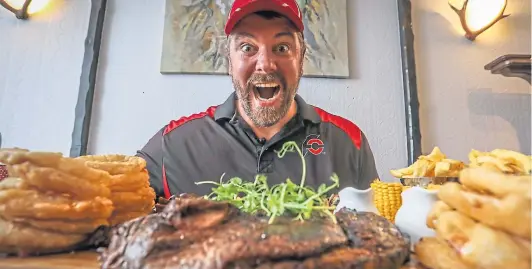  ?? ?? YouTube’s “profession­al eater” Randy Santel came from the US to accept Nicoll’s Steakhouse’s 60oz rump steak challenge.