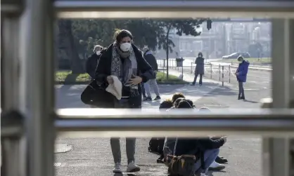  ?? Photograph: Luca Bruno/AP ?? Workers at the Unilever factory in Casalpuste­rlengo, northern Italy, where a 38-year-old fell ill with the coronaviru­s on Saturday.