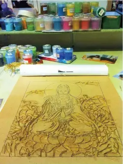  ??  ?? A half-finished thangka painting
