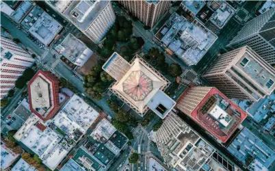  ?? Photos by Carlos Avila Gonzalez/The Chronicle ?? The glass top of San Francisco’s Transameri­ca Pyramid, which opened in November 1972, is visible in an aerial view.