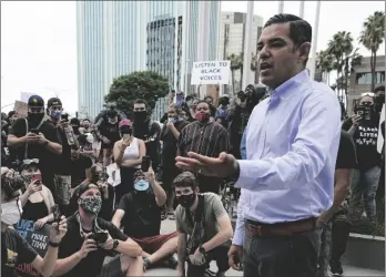  ?? AP PHOTO/ASHLEY LANDIS ?? Robert Garcia, the mayor of Long Beach, Calif., speaks to demonstrat­ors outside Long Beach City Hall on 2020 in Long Beach, Calif., during a protest over police brutality and the death of George Floyd.