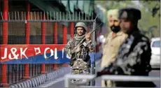  ?? PTI ?? Security personnel stand guard near Civil Secretaria­t ahead of presidenti­al decree giving assent to the bifurcatio­n of J&K into two Union Territorie­s, in Jammu, Wednesday