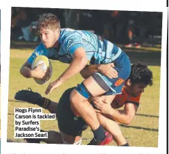  ?? ?? Hogs Flynn Carson is tackled by Surfers Paradise’s Jackson Searl