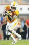  ?? STAFF FILE PHOTO BY C.B. SCHMELTER ?? Tennessee running back John Kelly carries against Southern Mississipp­i during the Nov. 4 game at Neyland Stadium. Kelly, who totaled more than 1,000 yards from scrimmage this season as a junior, announced Friday that he will enter the NFL draft.