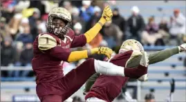  ?? Matt Freed/Post-Gazette ?? Steel Valley's Paris Ford celebrates a touchdown with Zai'Quan Henderson in the 2016 PIAA Class 2A championsh­ip. Steel Valley won every game by mercy rule during the season.