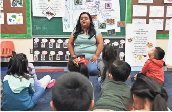  ??  ?? Rosa Ramirez, a preschool teacher at Gates Street Early Education Center in Los Angeles, says she remembers struggling with English in school when she was a child. “Now coming back and working where I grew up, I feel like many years ago I was where my kids are now,” she says. “I want to make sure they don’t go through the lack of confidence I faced.”