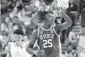  ?? CHUCK BURTON AP ?? Duke forward Mark Mitchell celebrates late during the second half of a win over Miami on Friday.